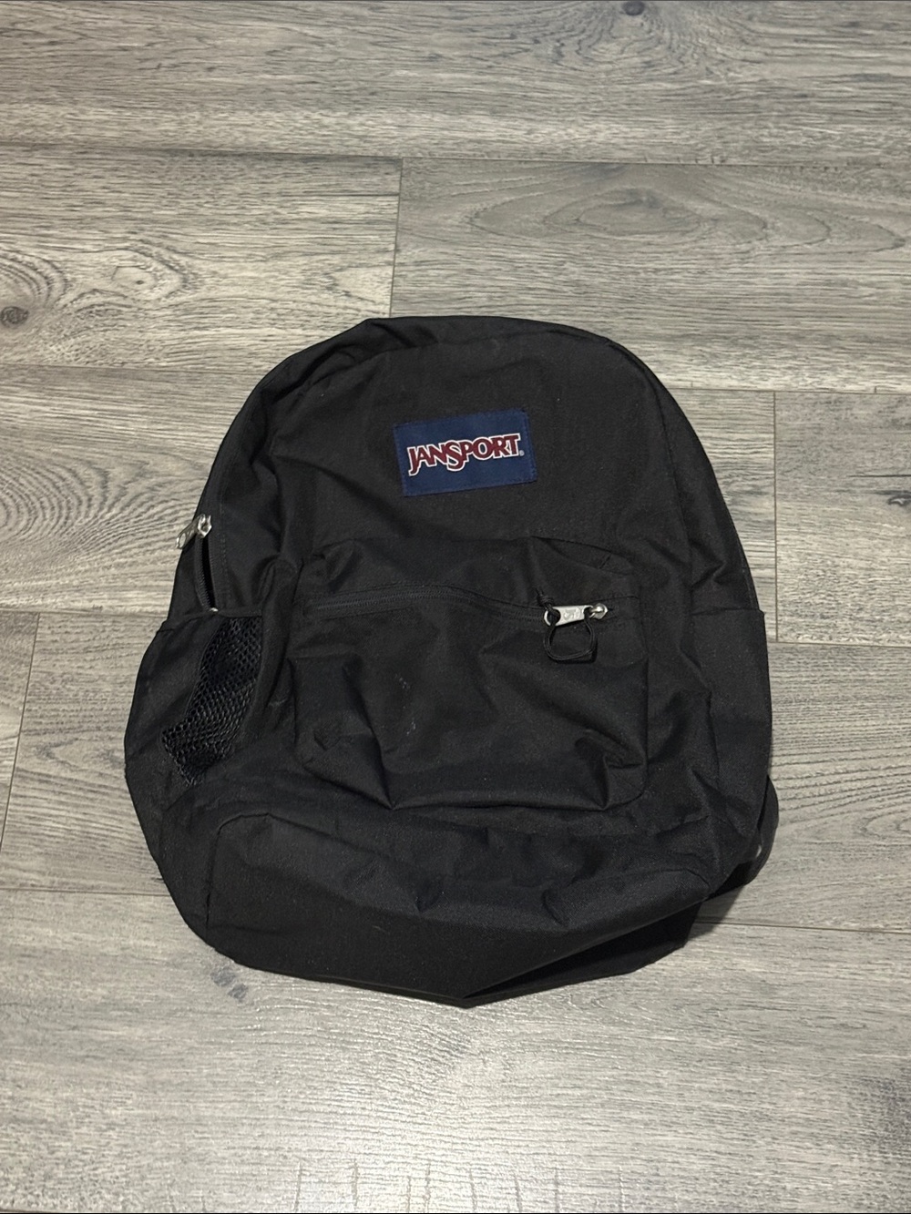Jansport Black Backpack with Navy Logo Patch